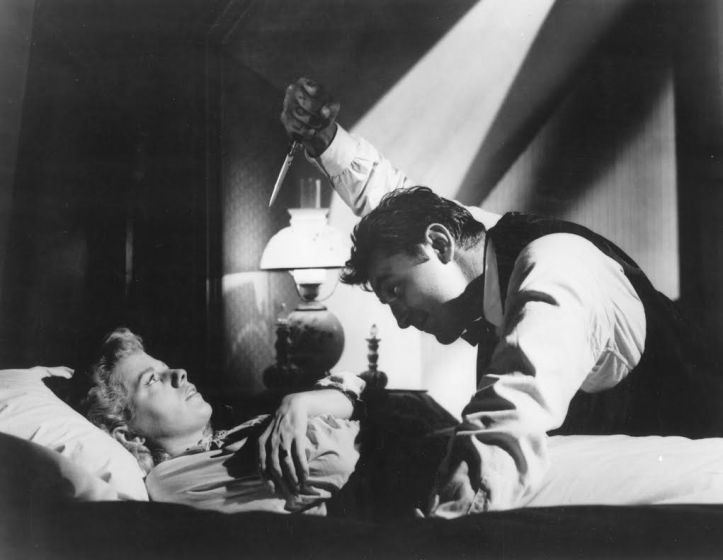 Actors Robert Mitchum and Shelley Winters perform in a scene from "The Night of the Hunter" in this undated photo released to the press on March 22, 2011. Stanley Cortez's cinematography in this sequence was greatly influenced by German expressionism. Source: Criterion Collection via Bloomberg EDITOR'S NOTE: NO SALES. EDITORIAL USE ONLY.